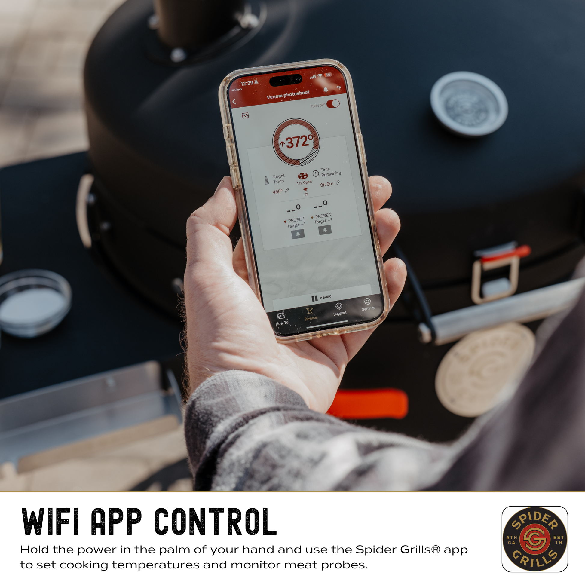 Hand holding a smartphone with Spider Grills app displayed, next to a grill.
